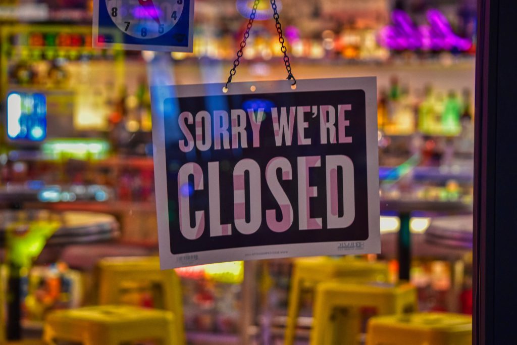 A closed sign on a business
