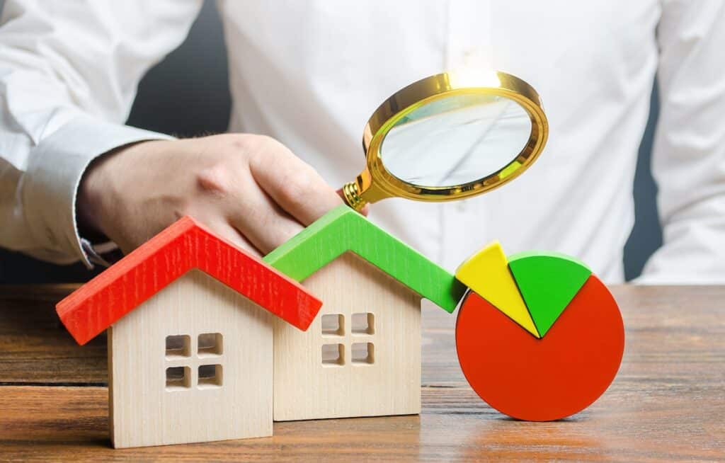 Graphic: Reconsideration of Value and Revision Requests. Examining homes with a magnifying glass.